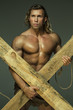© kazanovskyiphoto - Men with perfect muscular naked torso, holding hands wooden beams