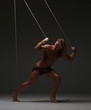 © kazanovskyiphoto - Young naked man, muscular body, bounded with rope