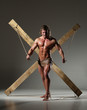 © kazanovskyiphoto - Sexual naked man, muscular, hands tied rope to wooden beams