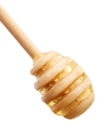 Canvas Print - Honey on wooden honey dipper isolated on white background