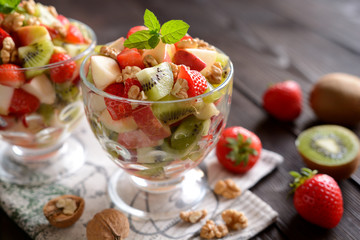 Wall Mural - Fruit salad in a glass bowl