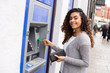 young woman at the cash machine