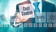 © Duncan Andison - A businessman selecting a Cost Control Concept button on a clear screen.