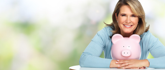 Sticker - Senior woman with a piggy bank.