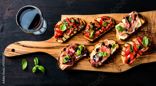 Brushetta set and glass of red wine Canvas Print