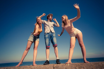 Group friends boy two girls having fun outdoor