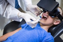 Boy Using Virtual Reality Headset During A Dental Visit