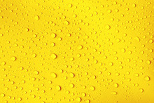 Water Drop On Fresh Yellow Background