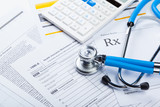 Fototapeta  - Health care costs. Stethoscope and calculator