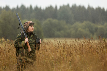 woman hunter, autumn rain, forest