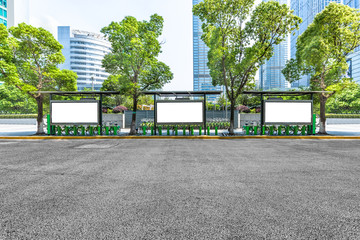 clean road with bus stop and modern buildings background