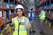 © WavebreakMediaMicro - Smiling female worker with thumb up