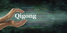 Qigong Word Cloud And Healing Hands - Female Cupped Hands With The Word QIGONG Between Surrounded By Word Cloud On A Flowing Green Light And Dark Background