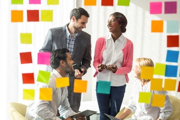 Aufkleber - Business people discussing over adhesive notes