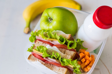 Wall Mural - Lunch box with sandwich and fruits