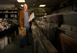 © Connect Images - Portrait of mature man in record shop, holding records
