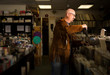 © Connect Images - Mature man in record shop, filing records
