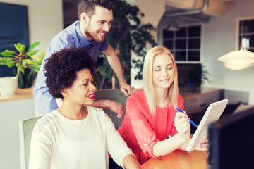 Wall Mural - happy creative team with computer in office