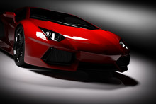 Red Fast Sports Car In Spotlight, Black Background. Shiny, New, Luxurious.