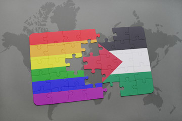 Wall Mural - puzzle with the national flag of palestine and gay rainbow flag on a world map background.