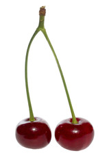 Two ripe red cherries on white background.