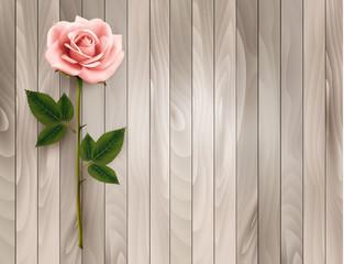 Poster - Single pink rose on an old wooden background. Vector.