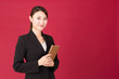 © taka - asian businesswoman isolated on red background