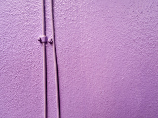 Telephone wiring on the purple wall