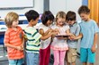 © WavebreakmediaMicro - Schoolchildren using digital tablet