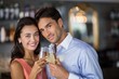 © WavebreakmediaMicro - Couple toasting glasses of wine