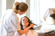 © Production Perig - Two young beautician students working during make up classes