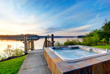 Awesome Water View With Hot Tub At Dusk In Summer Evening.