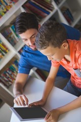 Poster - Teacher and school kid using digital table in library