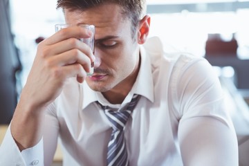 Depressed man having alcohol