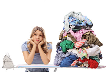 Wall Mural - Woman with pile of clothes for ironing