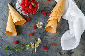Poster - Ice Cream Cones. The process of preparation of raspberry ice cream. Raspberry on a dark stone table.