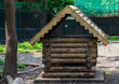 Small wooden house for animals in the aviary reserve