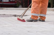 Construction worker sweeping