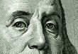 Fragment of face of Benjamin Franklin from the portrait of USA one hundred dollar note