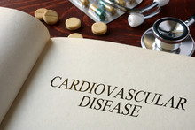 Book With Diagnosis Cardiovascular Disease And Pills. Medical Concept.