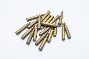 Wall Mural - old rifle cartridges 5.56 mm on a white background