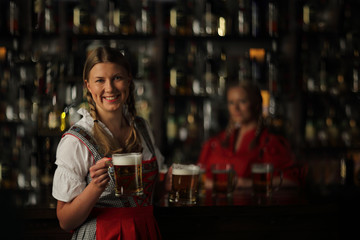 Wall Mural - Oktoberfest woman with beer