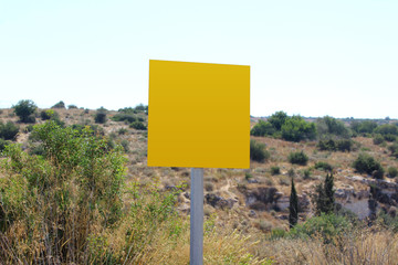 Blank and empty yellow road sign