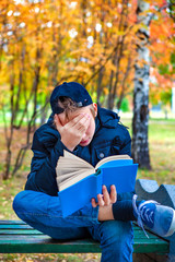 Wall Mural - Sad Teenager with a Book