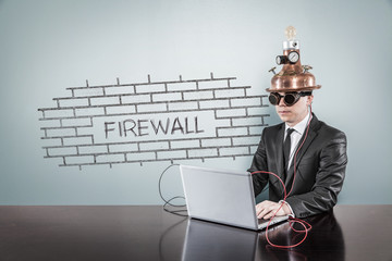 Firewall concept with vintage businessman and laptop