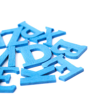Pile of colorful wooden letters isolated