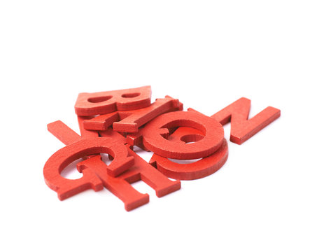 Pile of colorful wooden letters isolated