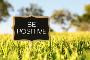 Wall Mural - Wooden chalkboard sign with quote: BE POSITIVE