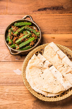 Bhendi Masala Or Bhindi Masala, Ladies Finger, Okra With Roti / Chapati / Fulka / Naan / Indian Bread / Paratha
