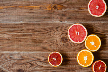 Citrus fruits on wood table background with copy space.